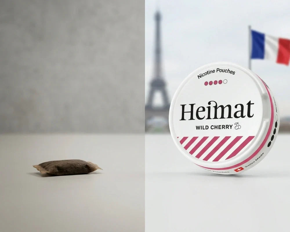 Una porzione di snus tradizionale marrone accanto a un barattolo di nicotina Heimat Wild Cherry, con la Torre Eiffel e una bandiera francese sullo sfondo